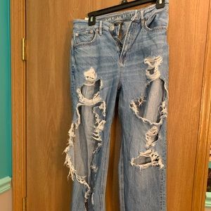 american eagle very distressed blue jeans